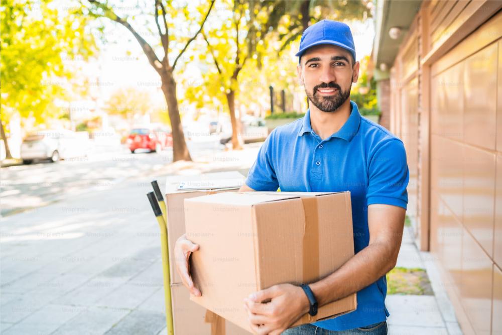 Delivery worker holding box